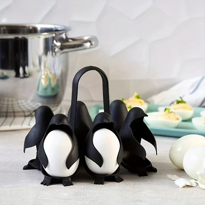 Penguin shaped egg cooker holder with boiled eggs
