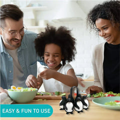 Egg Cooker - Family at a kitchen counter prep food with a penguin-shaped egg holder holding eggs in the foreground.