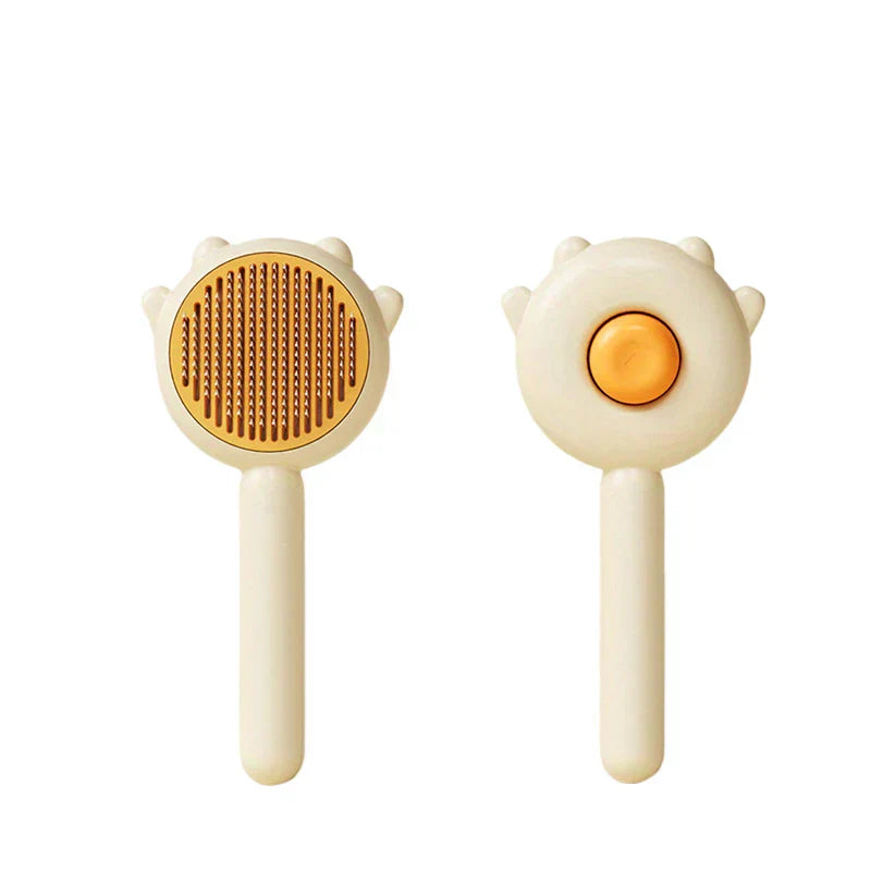 Pet Grooming Brush For Dogs - Cream-colored pet brush showing bristle side and self-cleaning button reverse side