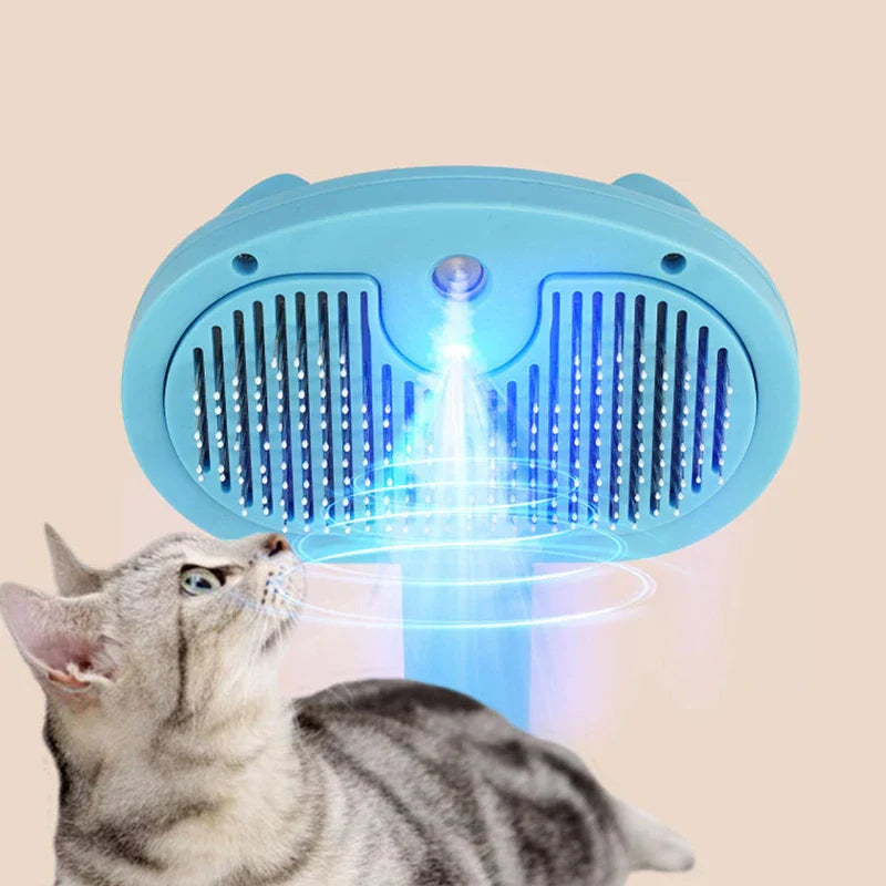 Blue Light Spray Grooming Comb Brush - Light blue pet grooming brush with blue light mist effect, with a tabby cat looking up at it