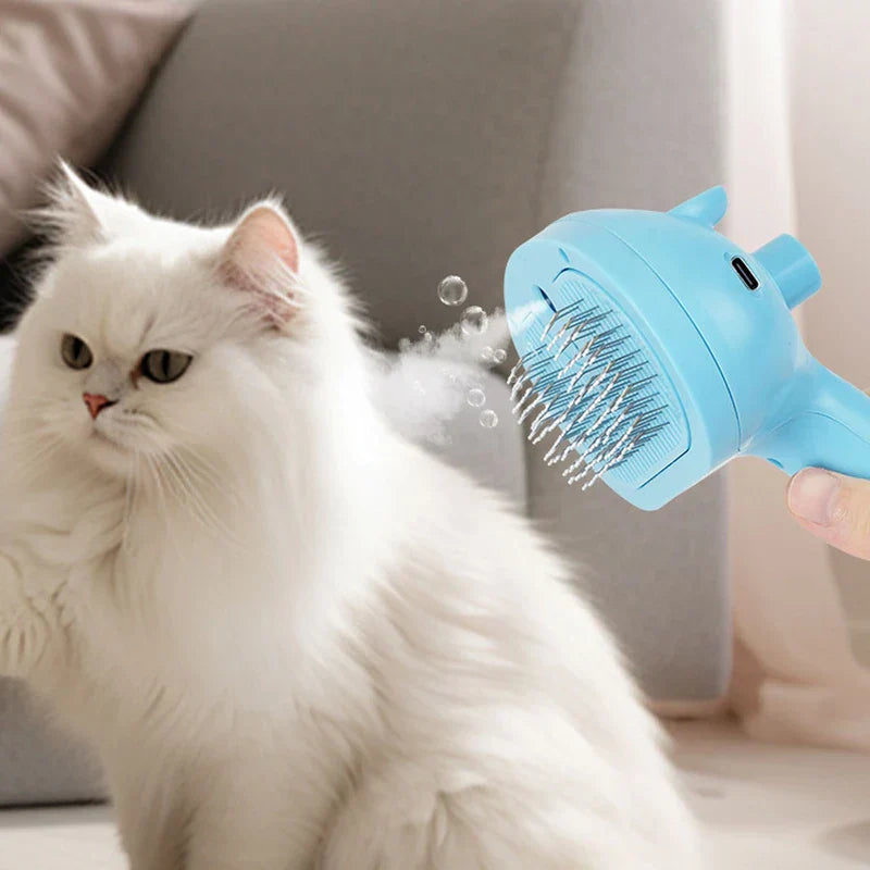 Blue Light Spray Grooming Comb Brush - Hand holding light blue pet grooming brush emitting spray and bubbles near a white long-haired cat
