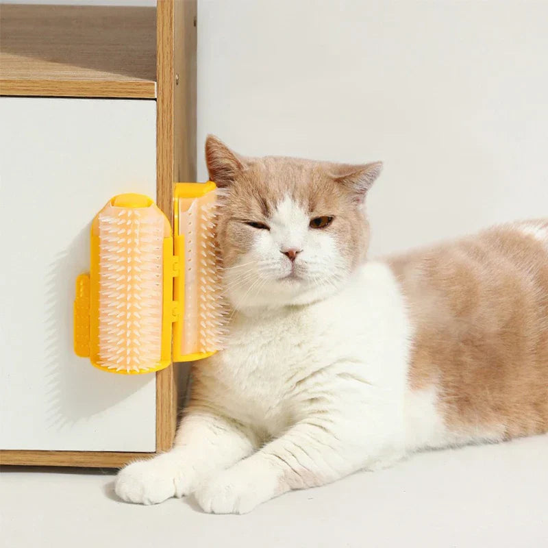 Pet Double Row Grooming Massager Brush - Cat rubbing against yellow mounted grooming brush attached to furniture corner