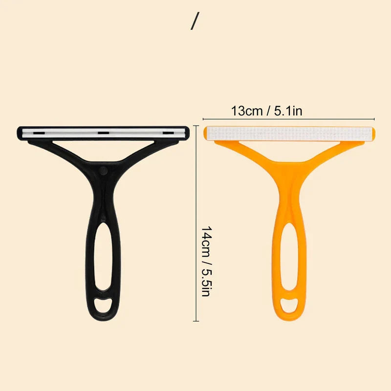 Pet Grooming Deshedding Brush - Size comparison view of two Y-shaped plastic tools, black and orange, with dimension lines marking length and width
