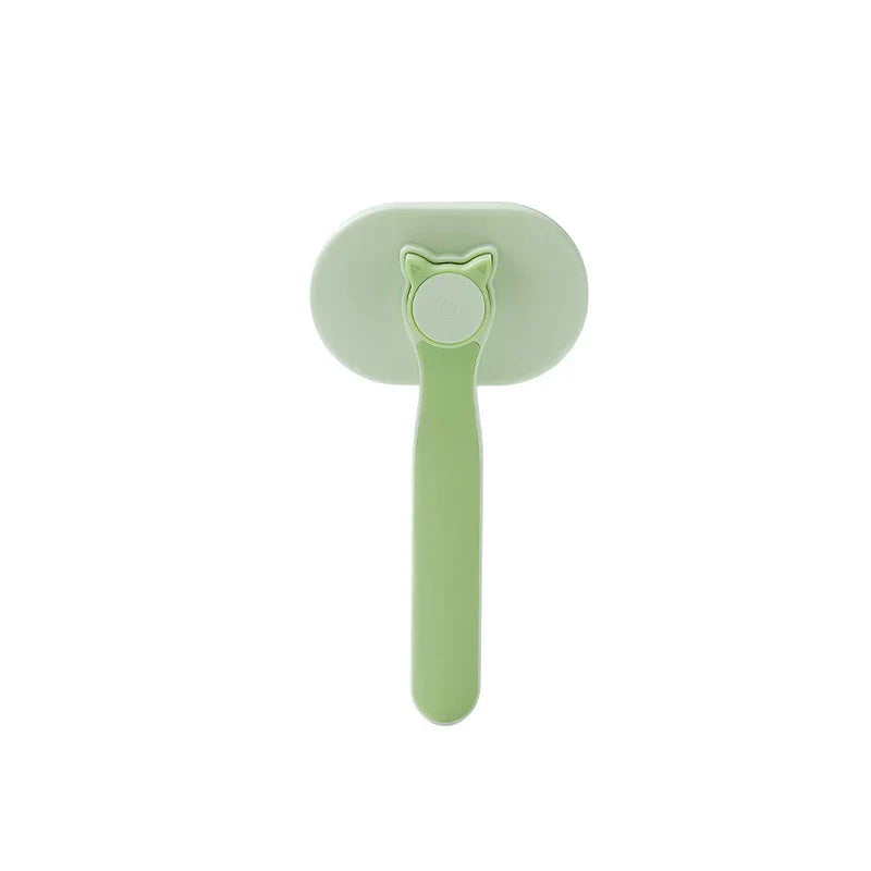 Cleaning Comb - Light green self-cleaning pet brush with cat ear shaped release button, closed bristle position