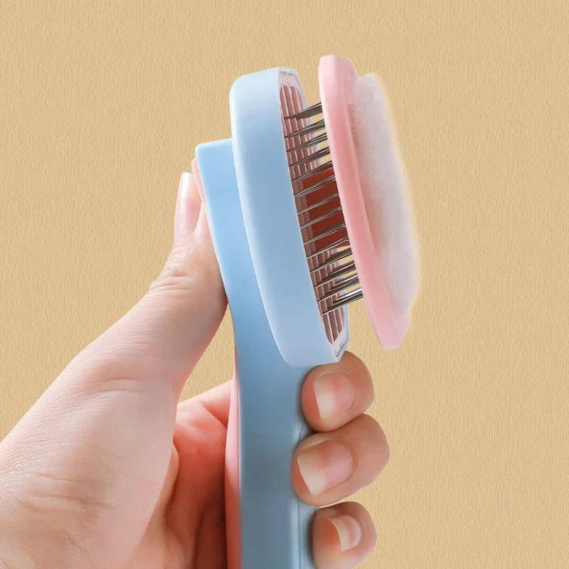 Cleaning Comb - Hand holding open pet brush with a layer of collected fur removed from its bristles