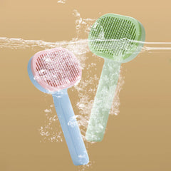 Cleaning Comb - Two pet slicker brushes, one blue with pink head and one light green, partially submerged in water with splashes and bubbles.