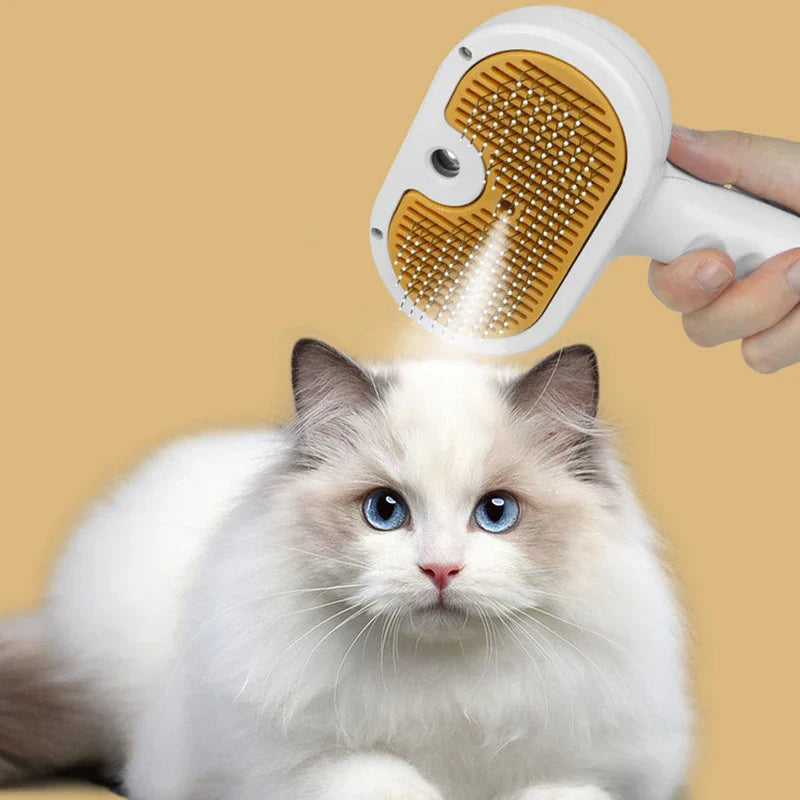Deshedding Rake - Hand holding the grooming tool positioned to brush the coat of a long-haired light-colored cat