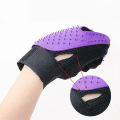 Pet Grooming Mitt - Close-up side view of grooming glove worn on a hand, showing breathable mesh side panel and adjustable wrist fastener with bristle detail inset