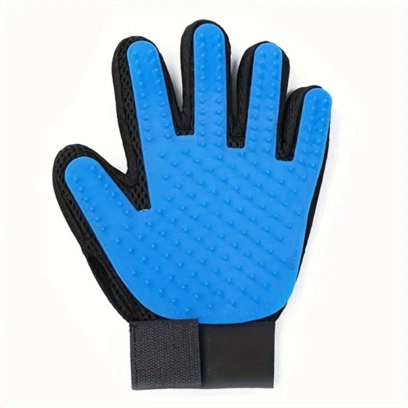 Blue and black pet grooming deshedding hair remover mitt with palm-side silicone nubs, on white background.