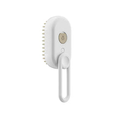 Pet Grooming Brush - White steam spray grooming brush with hanging loop, control buttons, and silicone bristle head