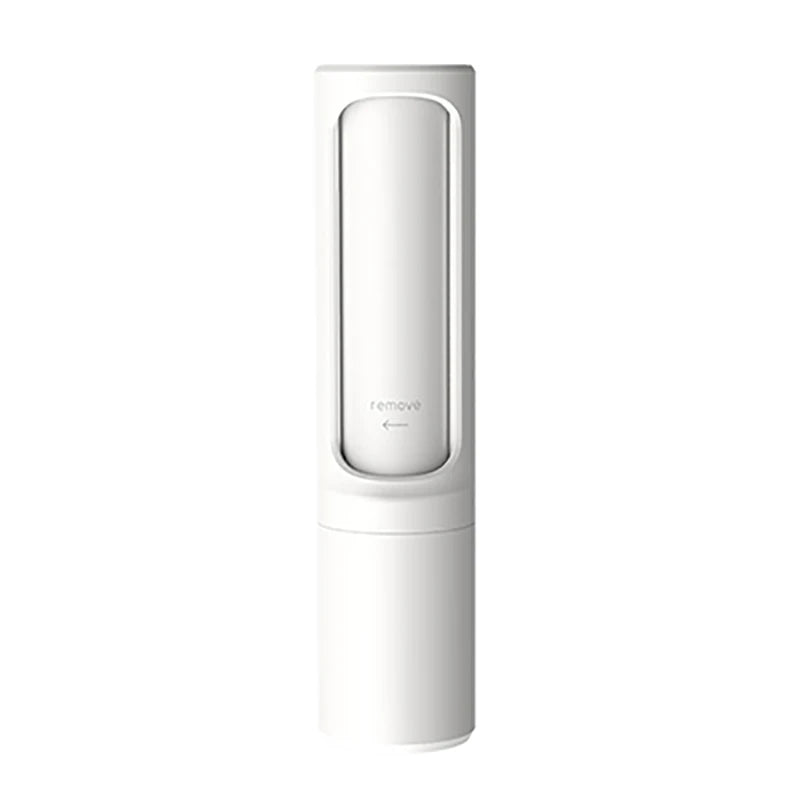 White pet hair remover brush with remove marking, shown against a plain white background
