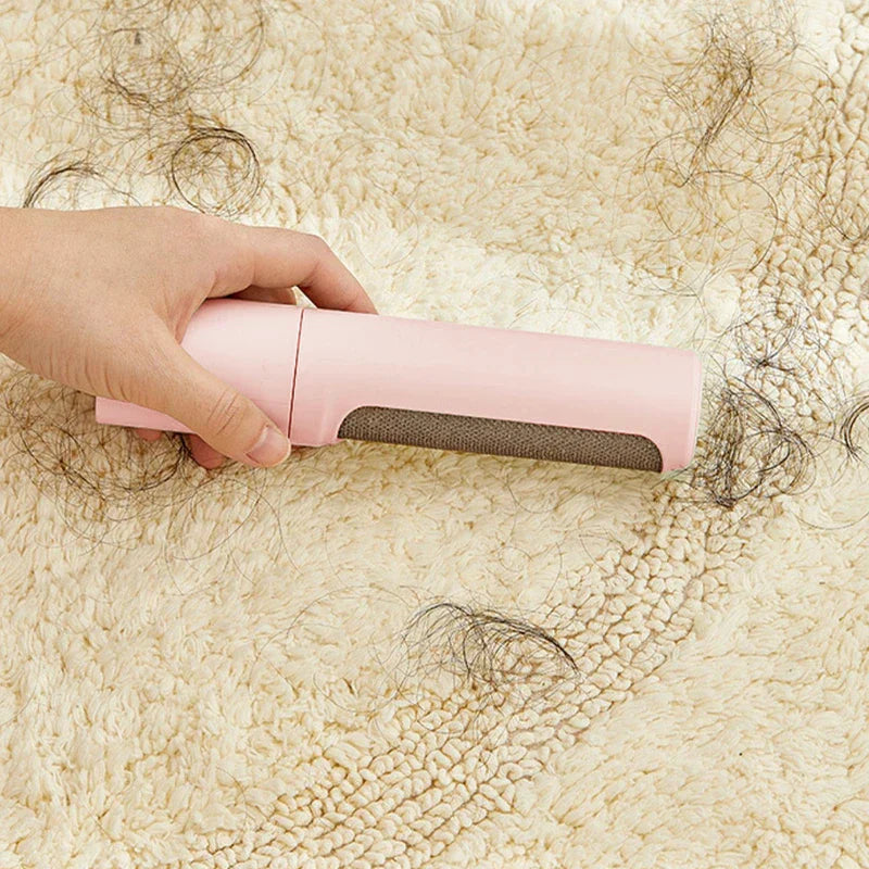 Pet hair remover brush roller held in hand