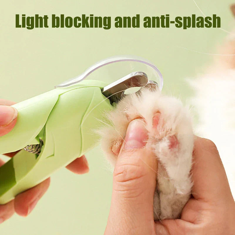 Hand using light green canine nail clippers to trim a fluffy white pet paw, with 'Light blocking and anti-splash' text