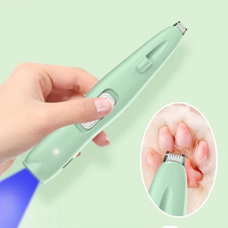 Close-up of the compact trimmer head between paw pads