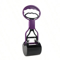 Pet poop scooper jaw grabber tool held over a grassy yard