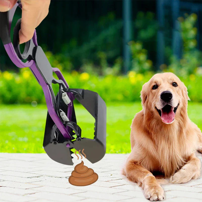 Pet poop scooper jaw grabber tool leaning against a fence