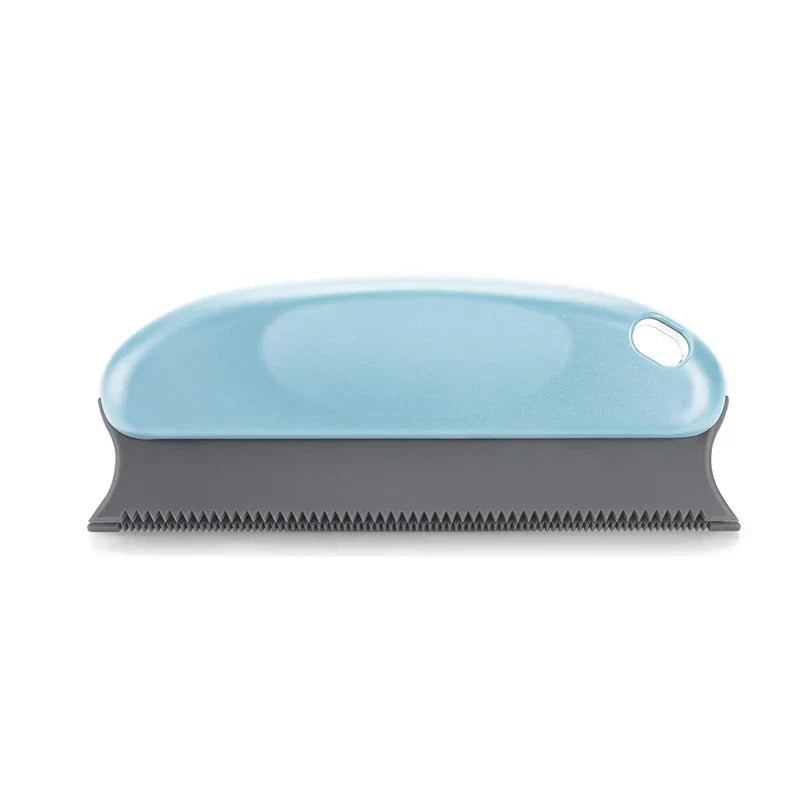 Pet grooming brush with shell design on a white background