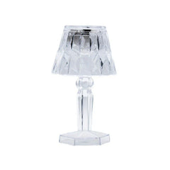 Single clear faceted mini led candle lamp with shade and hexagonal base on white background