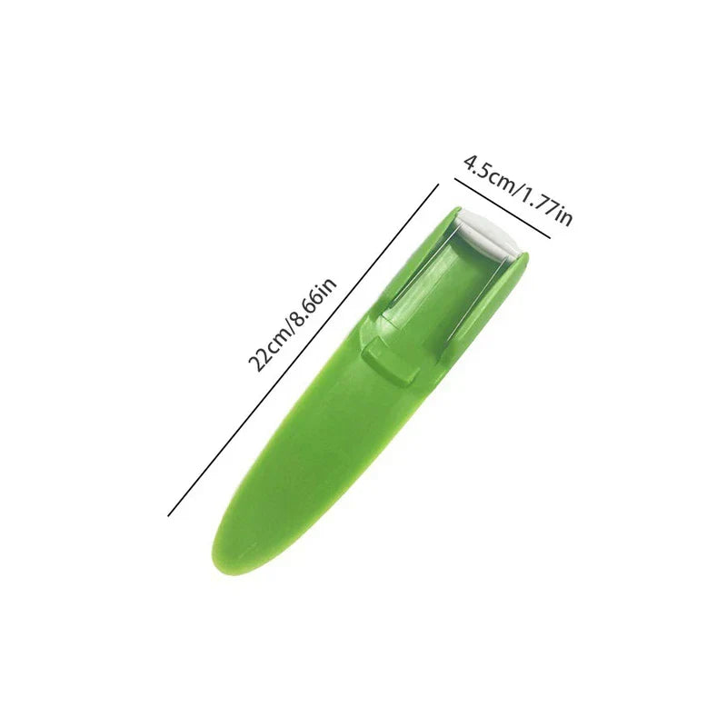 Green plastic melon slicer on white background, with 22cm length and 4.5cm head width measurement labels