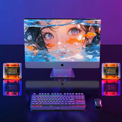 Portable Bluetooth Speaker - Two 5W MECHA portable bluetooth speakers sit beside a desktop computer with RGB keyboard on a dark gaming desk.