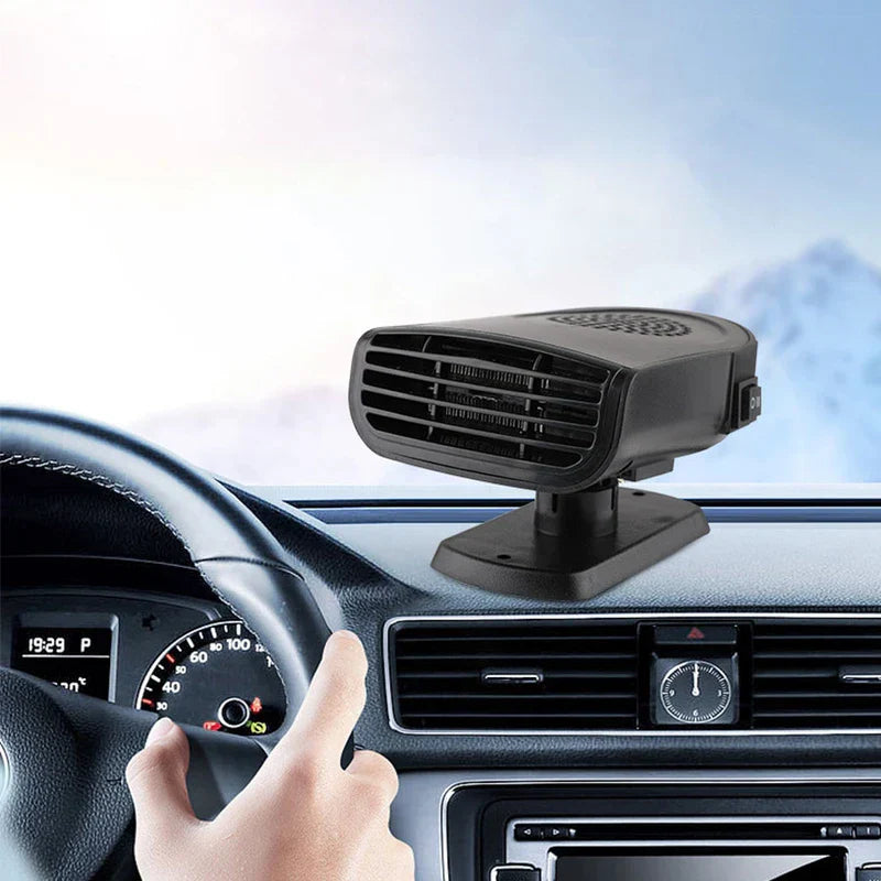 Portable car heater defroster fan mounted on a car dashboard, with a steering wheel and snowy outdoor background