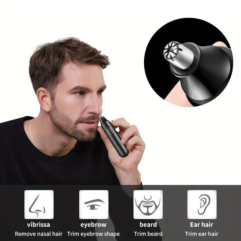 Electric nose hair trimmer pen held in hand for grooming