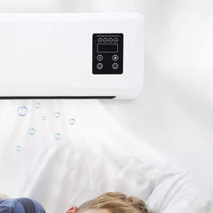 White wall-mounted fan heater with control panel, air bubbles below, and child's head on bed visible at bottom
