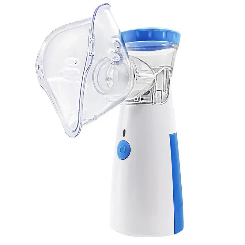Portable handheld mesh nebulizer with clear face mask on white background
