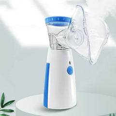 Blue white portable nebulizer with mask on light gray display surface