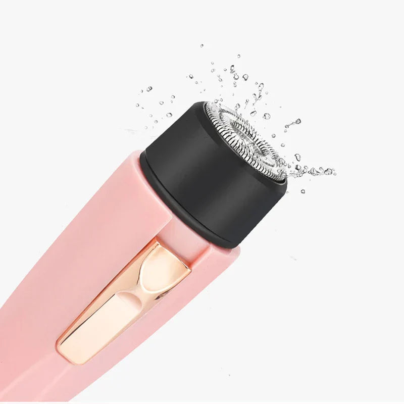 Waterproof pink women's facial hair trimmer with splash of water around shaver head