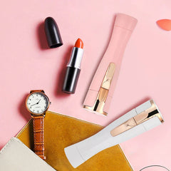 Portable lipstick-style women's electric shavers in pink and white with beauty accessories