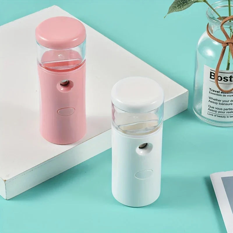 Compact nano facial mist sprayer humidifier on a table