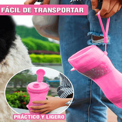 Pet water bottle dispenser in use during a walk