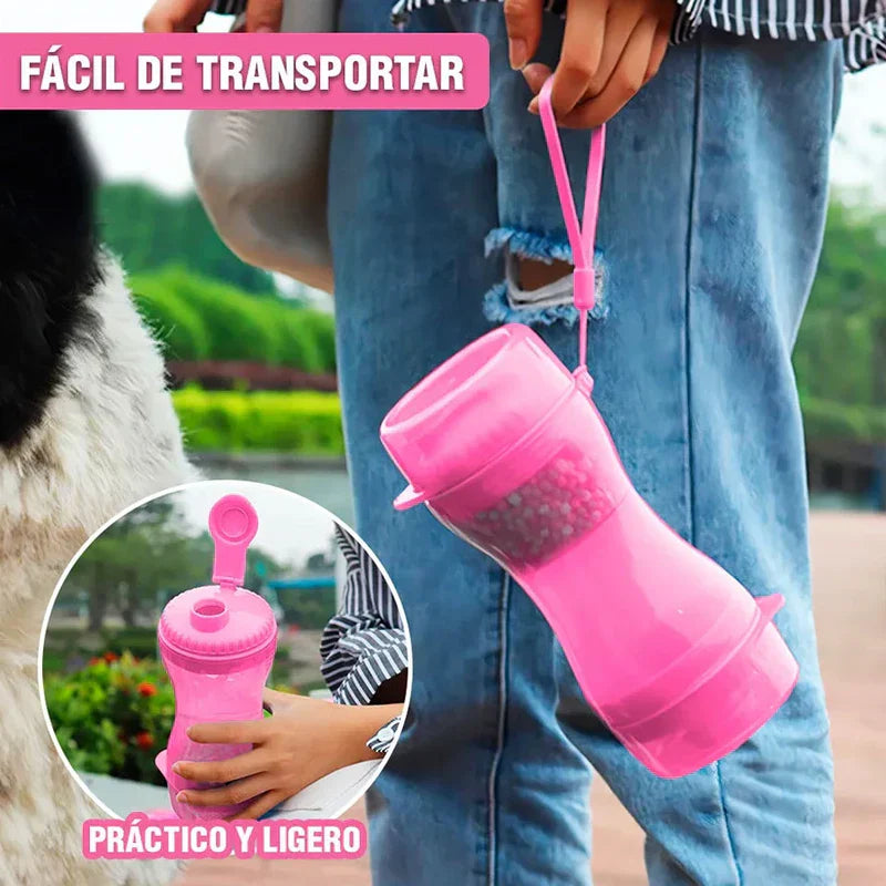 Hand holds pink portable water bottle dispenser by its lanyard; inset shows open top, outdoors with dog