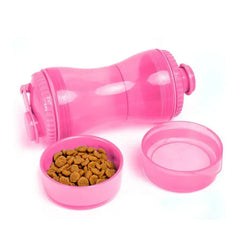 Pink portable water bottle dispenser laid on its side with two attached bowl lids, one holding pet kibble