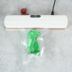 Handheld plastic bag sealing tool sealing a snack bag