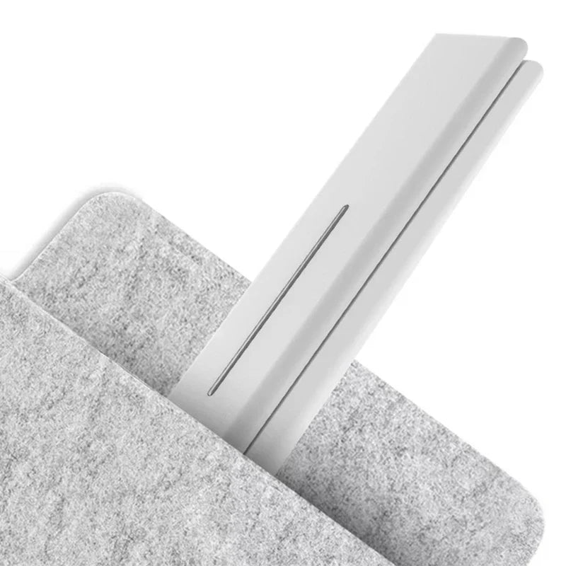 White led desk lamp partially placed inside a gray felt fabric pocket