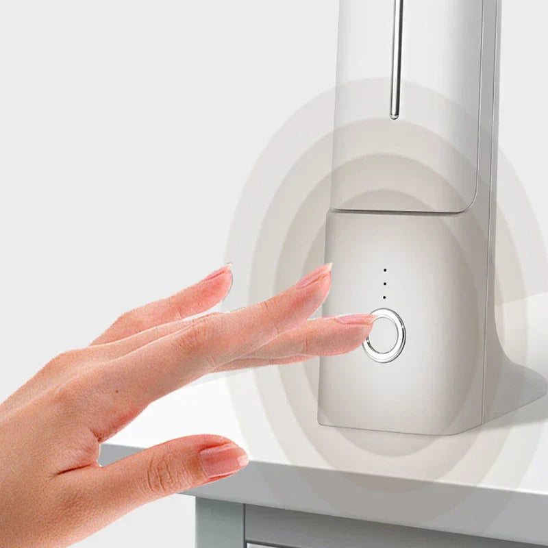 Hand approaching touch control of a white led desk lamp with circular ripple effect around the sensor area