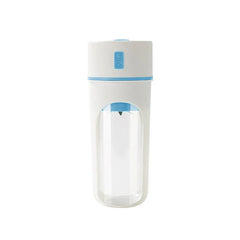 A white and blue blender juicer cup stands against a plain white background with a visible internal blade.