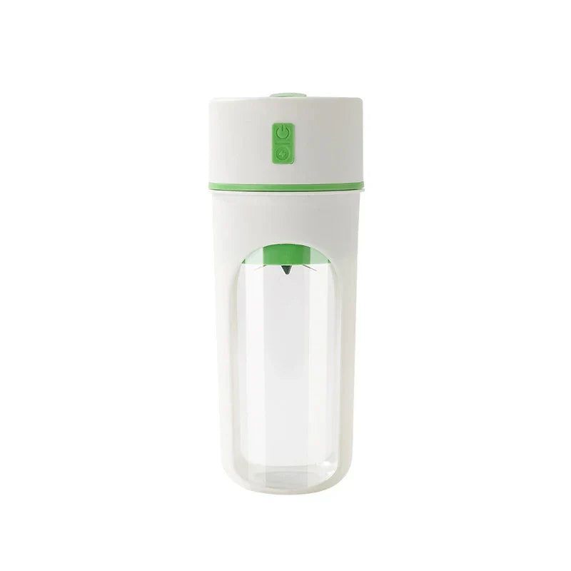 A white and green blender juicer cup stands against a plain white background with a visible internal blade.