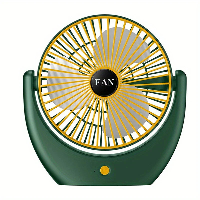 Ventilador de mano verde y amarillo con rejilla circular, aspas blancas y un botón de encendido en su base