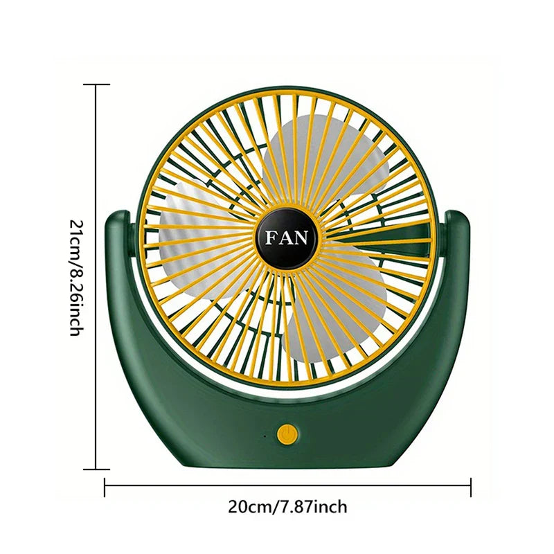 Ventilador de mano verde y amarillo con dimensiones etiquetadas: 21 cm de alto y 20 cm de ancho, mostrado con su rejilla frontal y botón de encendido