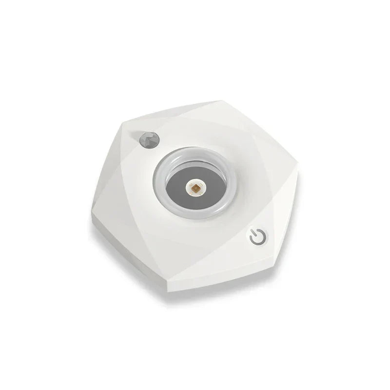 Angled view of a white faceted portable uv sterilizer lamp on a plain white background