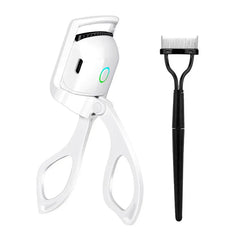 White heated eyelash curler and black lash comb set against a plain white background