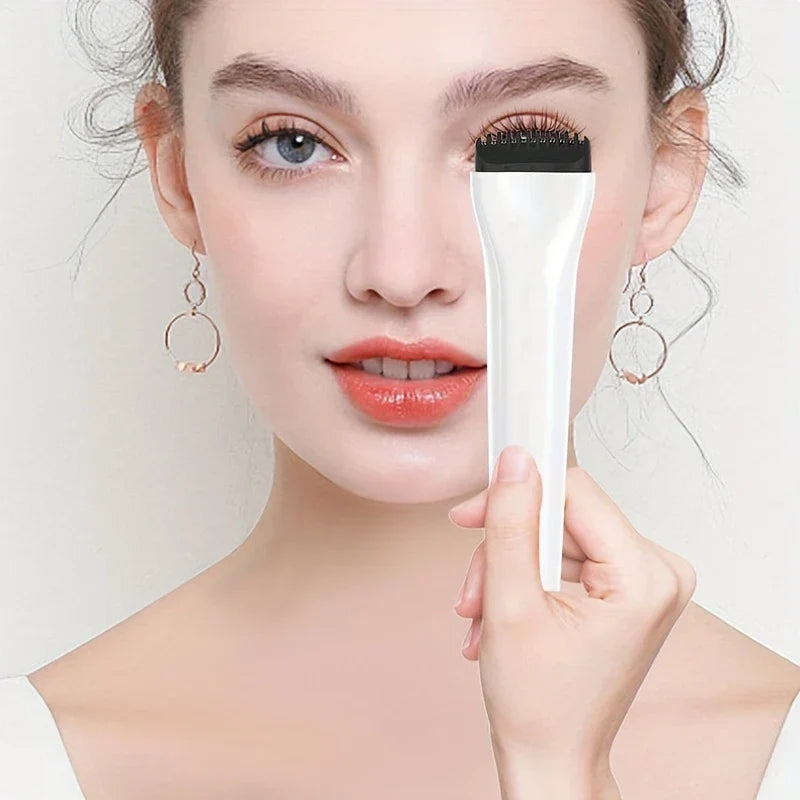 Person holding a white precision eyelash curler up to their upper eyelashes near one eye