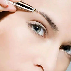 Close-up of hair cut shaper being used to trim eyebrow hair near a person's eye