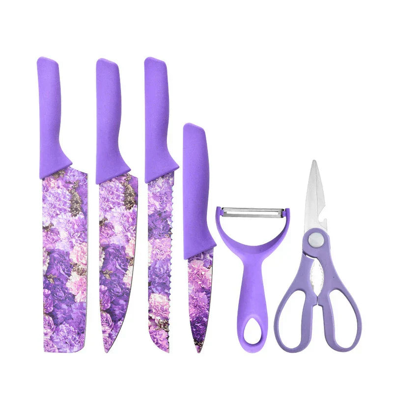 6 piece kitchen utensil set with purple floral patterned blades and purple handles arranged against plain white background