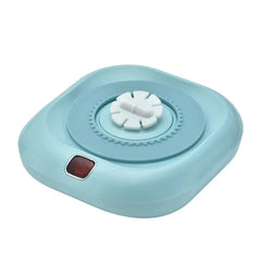 Light blue electric mixer base with white gear top, for a protein shaker bottle, shown against a white background