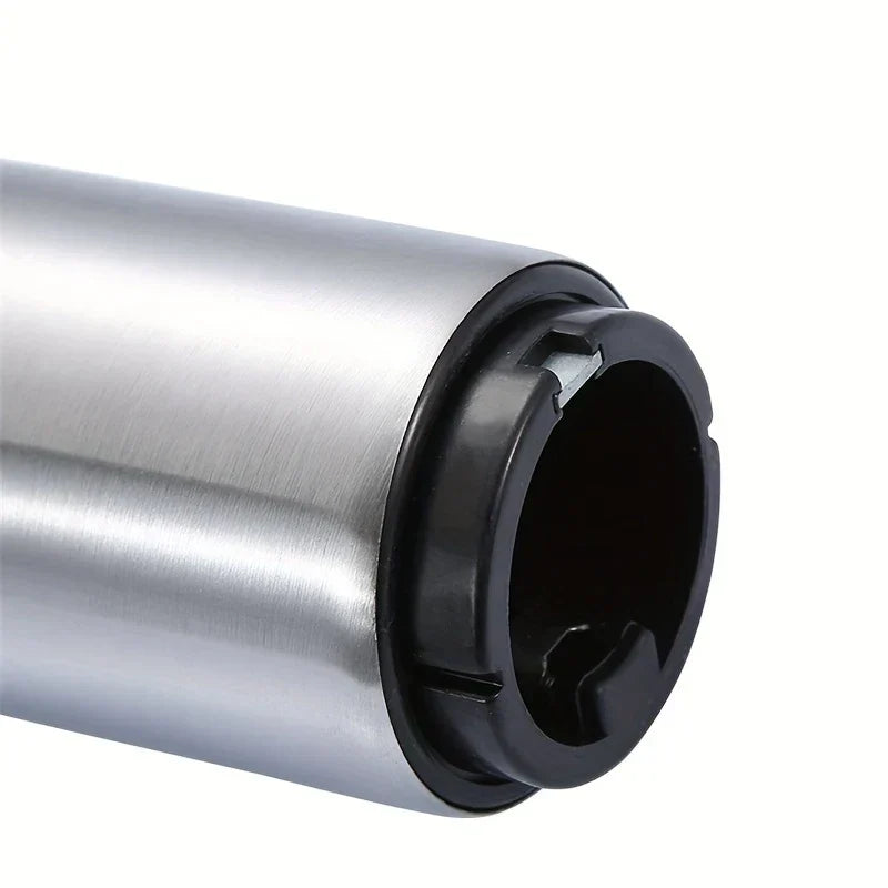 Side close-up of a stainless steel cylindrical beer bottle opener with black plastic end cap