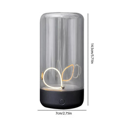 Cylindrical desk lamp with clear shell and curved internal led light panel, height 14.5cm, width 7cm